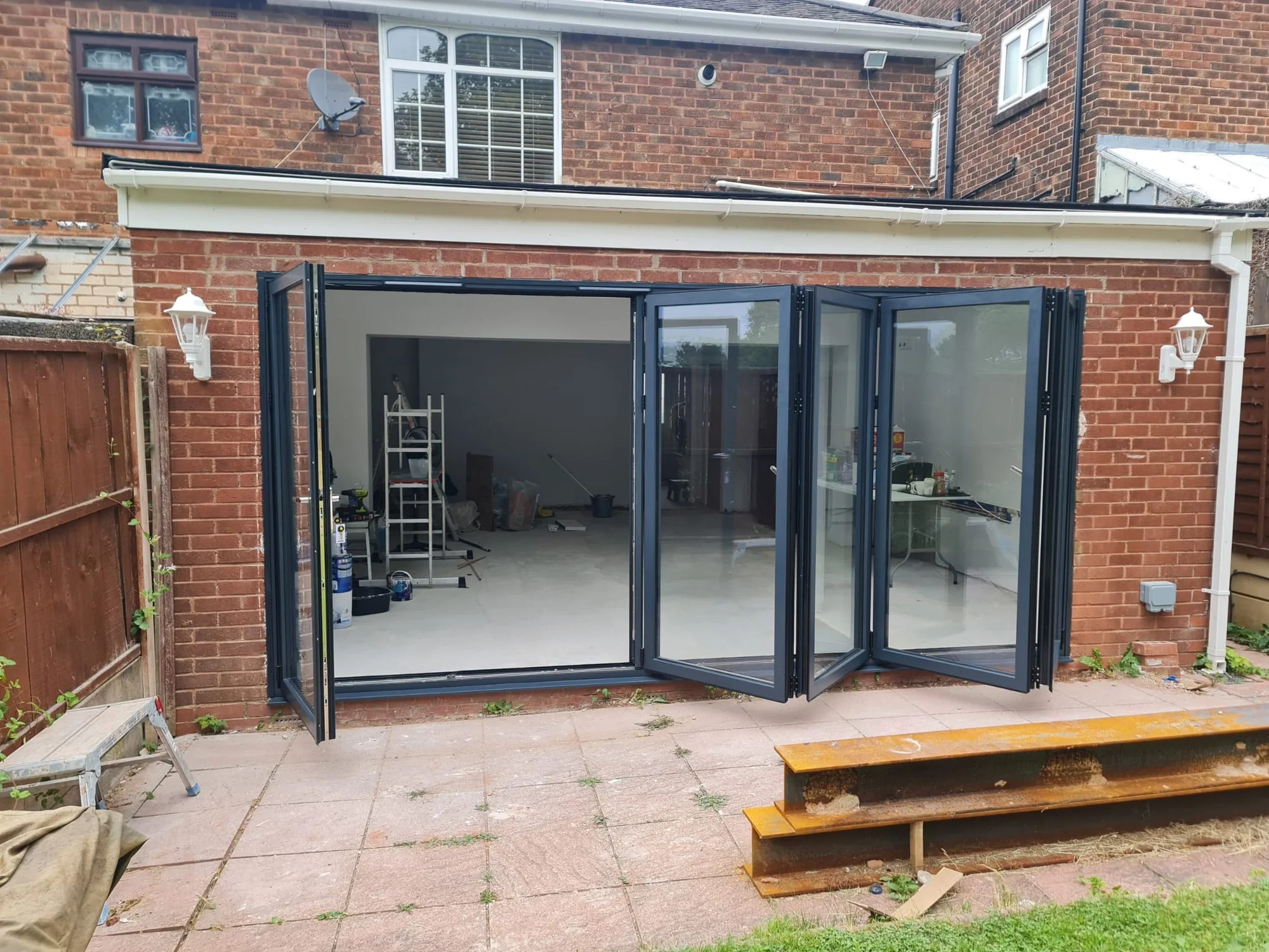 Wide anthracite bi-fold doors viewed from the garden