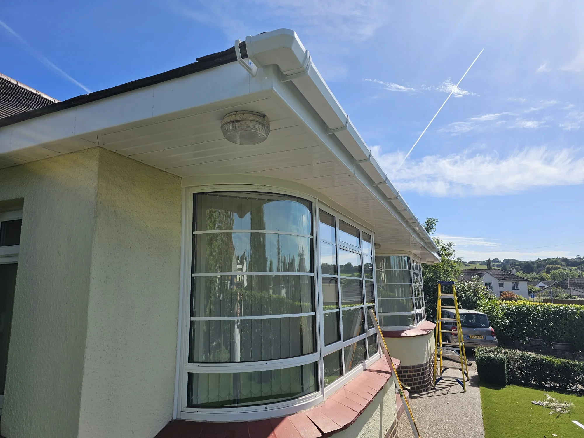 Clean white soffit and fascia detail beneath a tiled roof