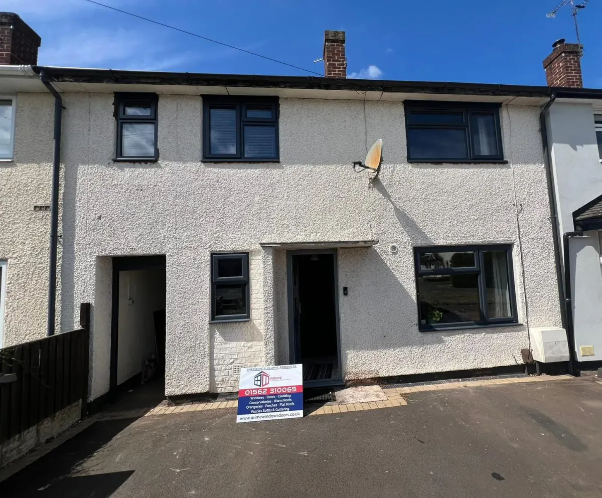 Dark replacement windows installed across a complete home by Prime Windows